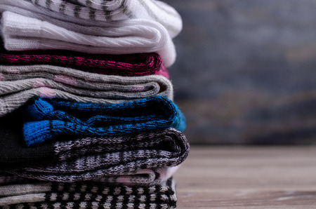 Short clean knitted socks on wooden background. Selective focus.の写真素材