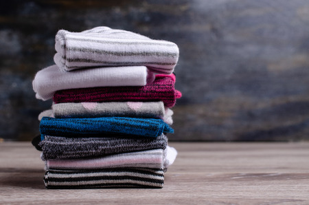 Short clean knitted socks on wooden background. Selective focus.の写真素材