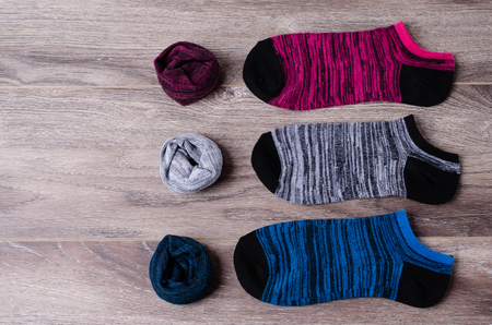 Short clean knitted socks on wooden background. Selective focus.の写真素材