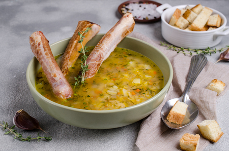 Traditional thick soup with peas, vegetables and smoked ribs. Selective focus.の写真素材