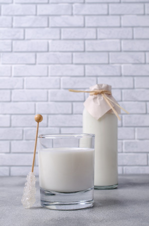 Organic dairy product in glass on shale background. Selective focus.の写真素材