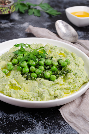 Mashed potatoes with green peas and pesto. Selective focus.の写真素材