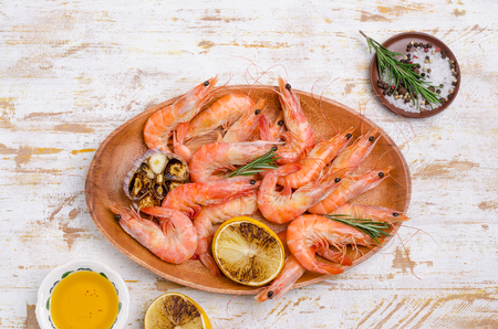 Fried unpeeled large shrimp with garlic and lemon. Selective focus.の写真素材