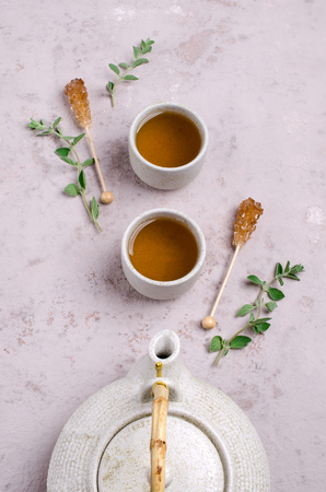 Traditional green herbal tea with oregano and sugar. Selective focus.の写真素材