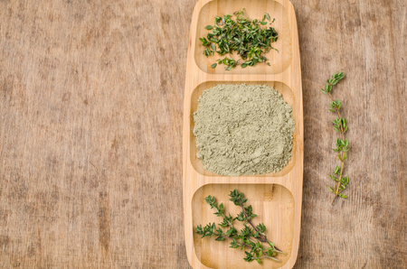 Spice mix of thyme on rustic wooden background. Selective focus.の写真素材