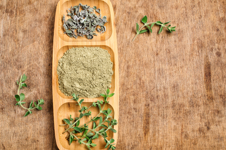 Spice mix of oregano on rustic wooden background. Selective focus.の写真素材