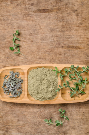 Spice mix of oregano on rustic wooden background. Selective focus.の写真素材