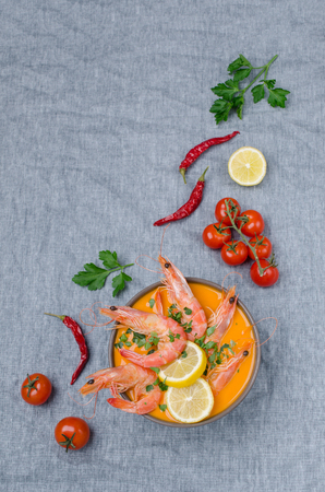 Traditional creamy soup with shrimp in a bowl on the table. Selective focus.の写真素材