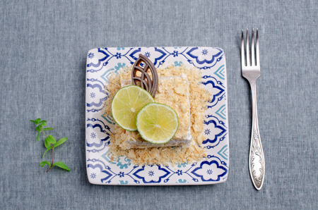 Layer cake with white cream and slices of fruit with chocolate. Selective focus.の写真素材