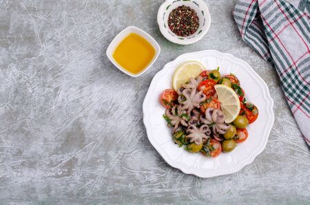 Salad with octopus and fresh vegetables in the marinade. Selective focus.の写真素材