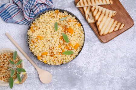 Traditional pasta with pumpkin slices and pine nuts. Selective focus.の写真素材