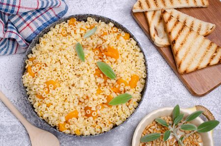 Traditional pasta with pumpkin slices and pine nuts. Selective focus.の写真素材