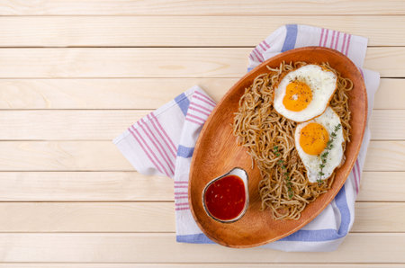 Wholegrain pasta with minced meat and fried eggs. Selective focus.の写真素材