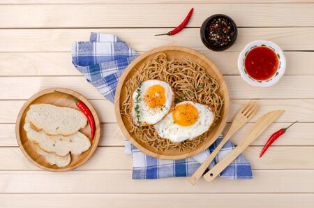 Wholegrain pasta with minced meat and fried eggs. Selective focus.の写真素材