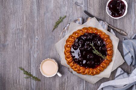 Open pie with berry jam on a wooden background. Selective focus.の写真素材