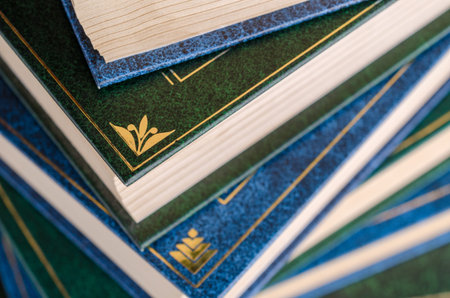 Closeup background of a stack of books. Design concept. Selective focus.