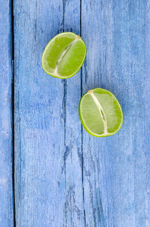 Fresh citrus fruits on an old blue background. Design concept. Selective focus.