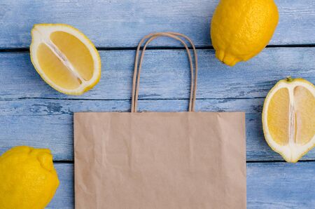 Fresh lemons on an old blue background. Design concept. Selective focus.の写真素材