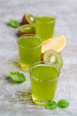 Fruit drink in glass on a light background. Selective focus.の写真素材