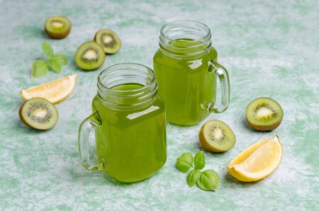 Kiwi drink in glass on a wooden background. Selective focus.の写真素材