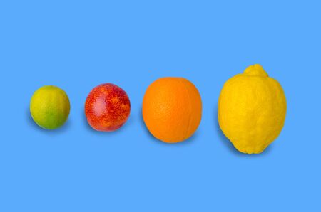 Fresh citrus fruits on an old blue background. Design concept. Selective focus.の写真素材