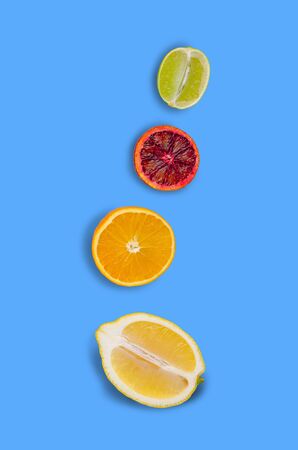 Fresh citrus fruits on an old blue background. Design concept. Selective focus.の写真素材