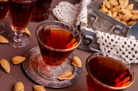 Traditional brown almond liquid in a glass on a stone background. Selective focus.の写真素材