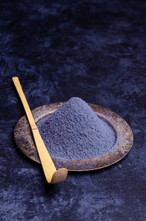 Traditional blue tea powder on a dark background. Selective focus.の写真素材