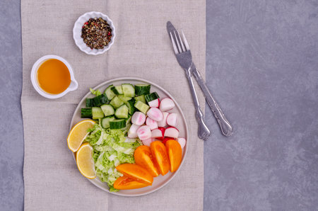 Mix slices of vegetables in a dish on a gray stone background. Selective focus.の写真素材