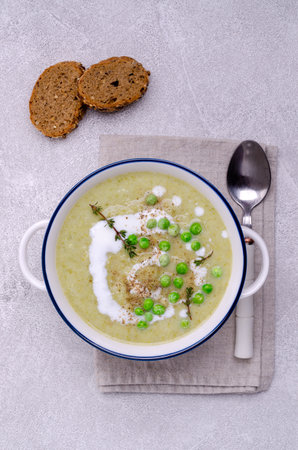 Thick vegetable soup with yogurt on a gray stone background. Selective focus.の写真素材