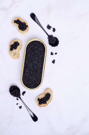 Organic black caviar in a dish on a light background. Selective focus.の写真素材