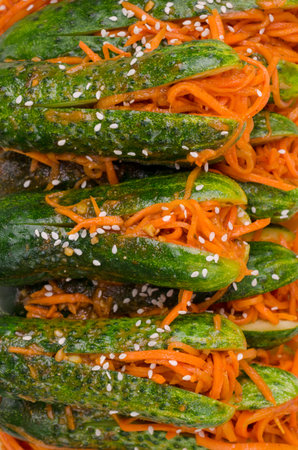 Fermented cucumbers with carrots and spices. Traditional Asian cuisine. Selective focus.