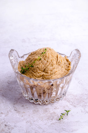Traditional fish pate in a ceramic dish on a light background. selective focus.