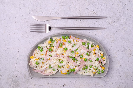 Vegetable salad with bacon in white sauce on a light background. top view.の写真素材