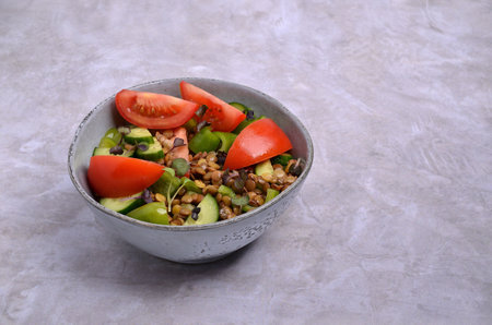 Salad slices of raw vegetables with lentils and microgreens. selective focus.の写真素材
