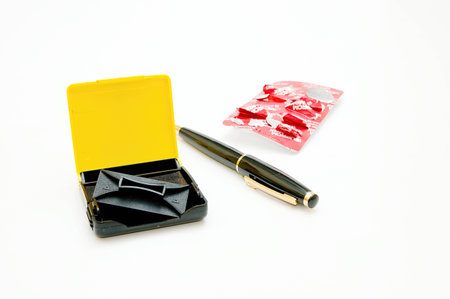 Stamp and a pen and tablet on white backgroundtleの写真素材