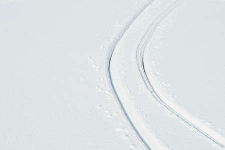 abstract white snowflake wallpaper with two parallel tracesの写真素材