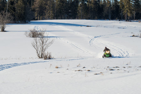 Polish Tatra Mountains, snowmobile and winter recreation, mountain peaks and a wall of mountain...