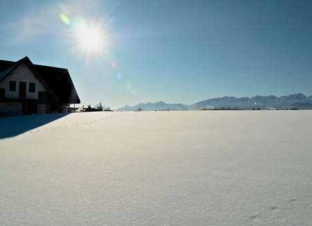 Traditional mountain hut in the Tatra Mountains in winter. Snow and sunriseの写真素材