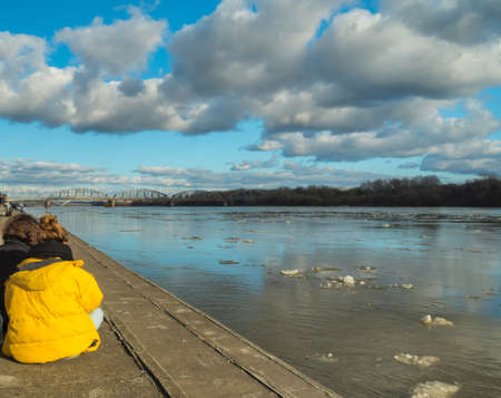 boulevard above the river and the girl in a yellow jacketの写真素材