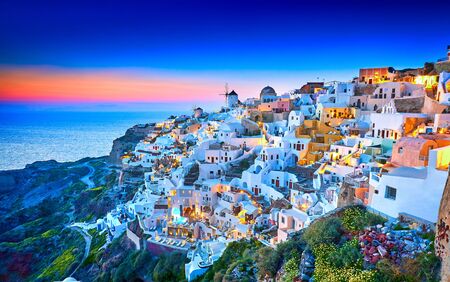 Church of Santorini. Fira town on Santorini island, Greece. Incredibly romantic sunset on Santorini. Oia village in the morning light. Amazing sunset view with white houses. Island loversの写真素材