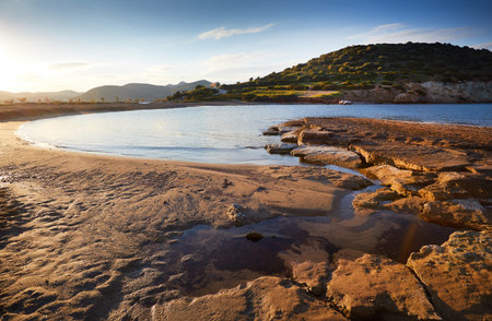 Sunrise on Nuevo Loca Beach. Traveling concept background. Palaia Fokaia, beginning of the beach...