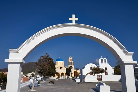 View on the white church. Fira town on Santorini island, Greece. Incredibly romantic sunset on Santorini. Oia village in the sun light. Amazing sunset view with white houses. Island loversの写真素材