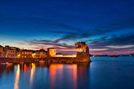 Panoramic view of the illuminated port of Nafpaktos, Greece. Nafpaktos is a popular tourist...