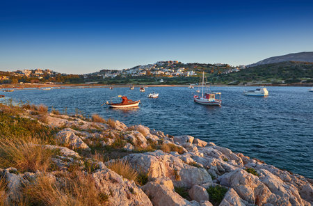 Fishing boats in the morning light. Sunrise on Nuevo Loca Beach. Traveling concept background....