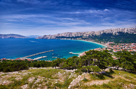 Aerial view of Baska town. Bright summer seascape of Adriatic sea, Krk island, Kvarner bay, Croatia, Europe. Splendid morning cityscape of Bashka town.  Beautiful world of Mediterranean countries.の写真素材