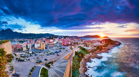 Amazing sunset view from the walls of the citadel of Calvi, the old town with historic buildings. Luxurious marina and very popular tourist destination. Corsica, France, Europeの写真素材