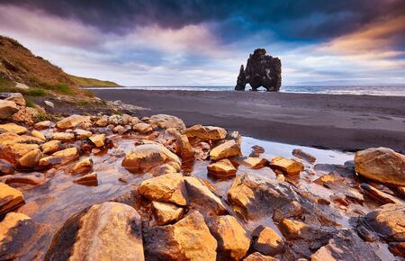 Hvitserkur is a spectacular rock in the sea on the Northern coast of Iceland, Europe. Legends say it is a petrified troll, basalt rock in the form of a huge scary monster.  Tourist attraction.の写真素材