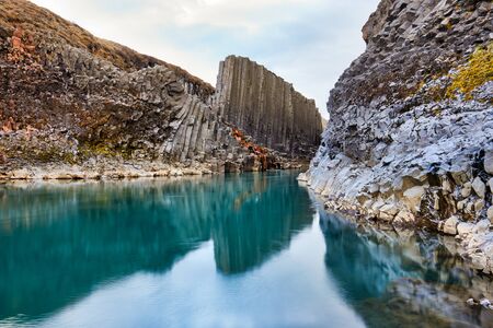 Studlagil basalt canyon, Jokulsa a Dal River. Iceland, Europe.  One of the most wonderfull hidden place and nature sightseeing. Famous tourist landscape with basalt rock formations. Travel postcard.の写真素材