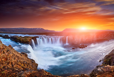 Incredible frosty morning and sunrise at the most famous place of Golden Ring Of Iceland. Godafoss waterfall near Akureyri in the Icelandic highlands, Europe. Popular tourist attraction. Postcard.の写真素材